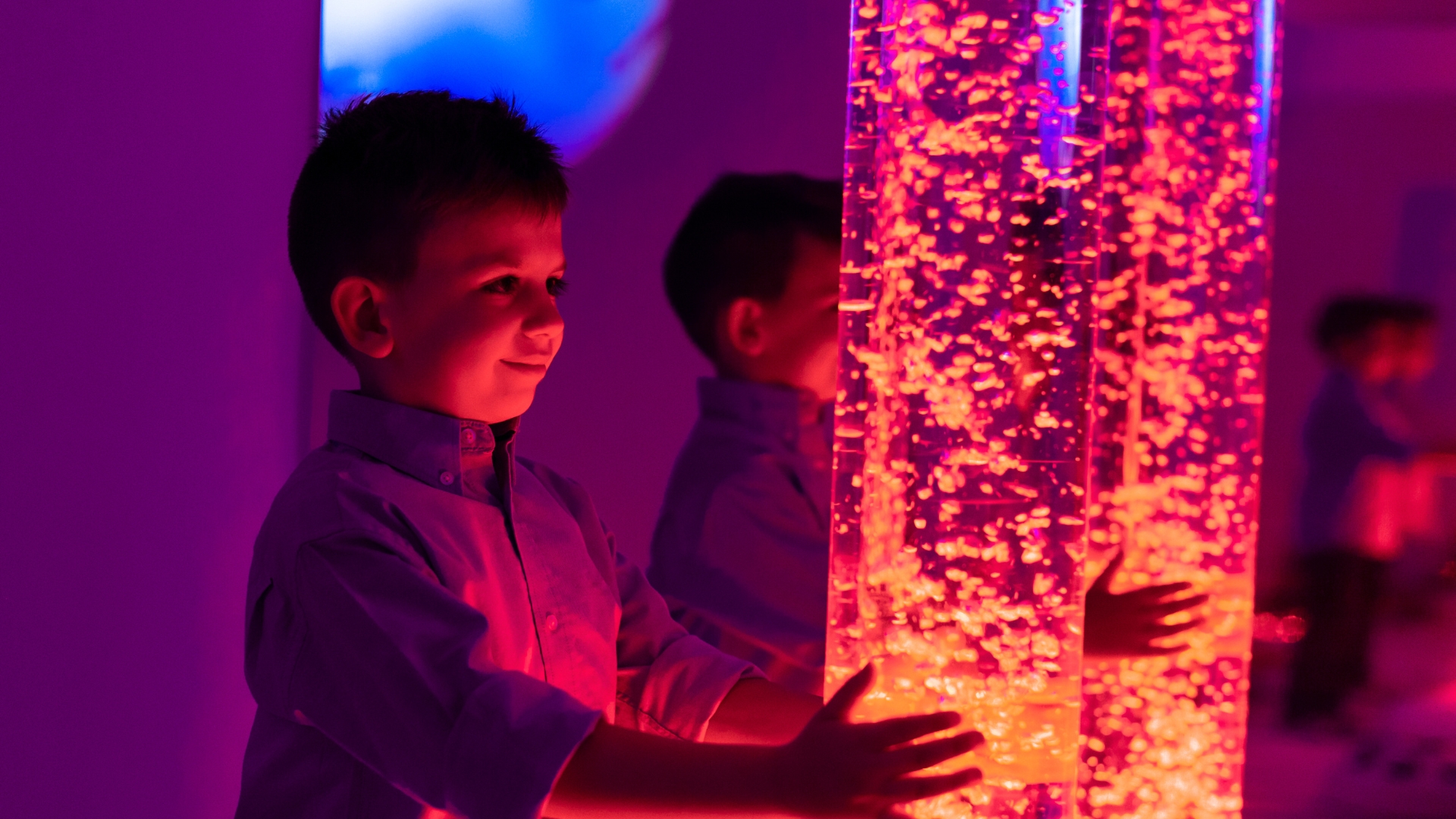 Occupational therapist supporting an autistic child with sensory regulation