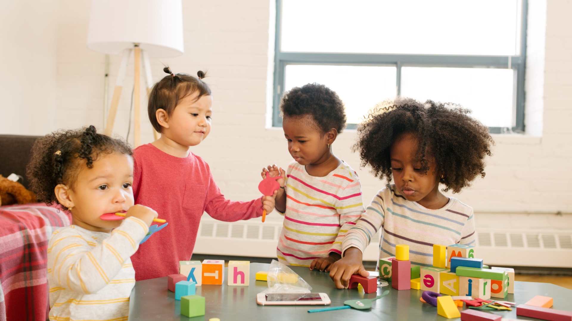 Young child building speech skills through play-based apraxia therapy at home