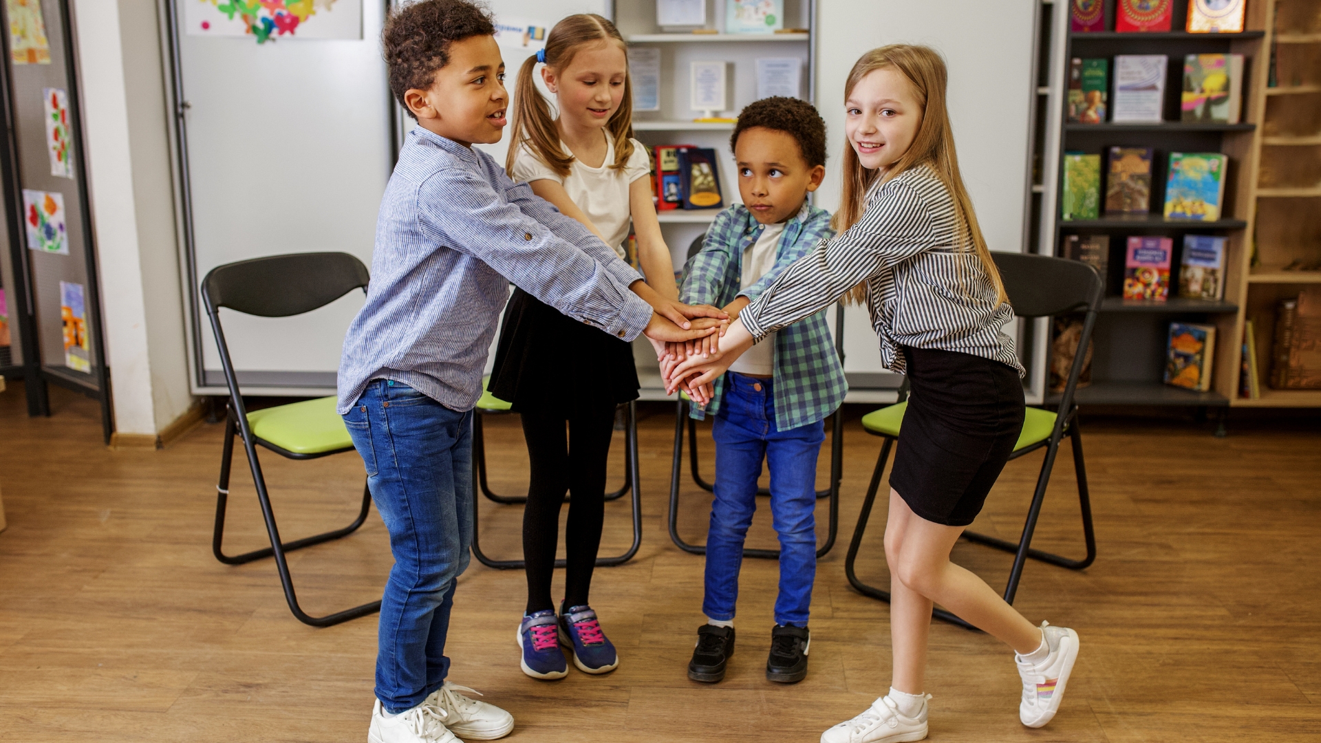 Pediatric therapist supporting a child during a school-based session