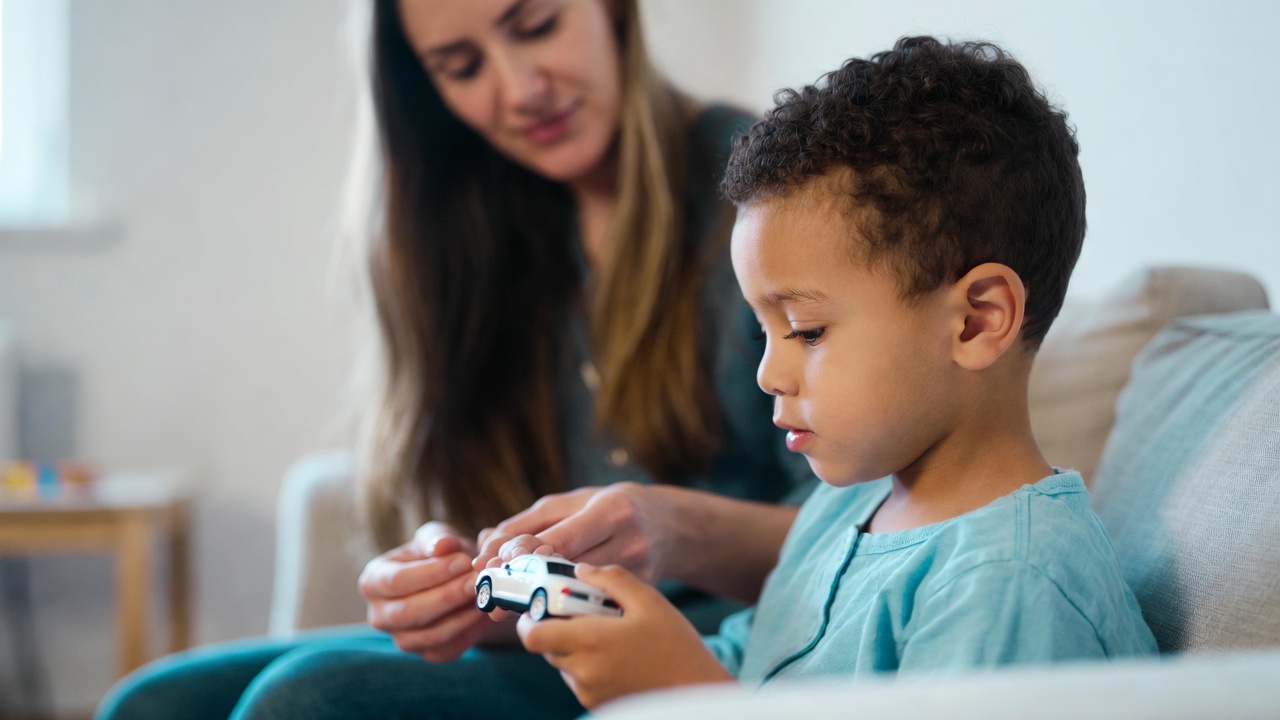 Therapist supporting a family during early intervention at home