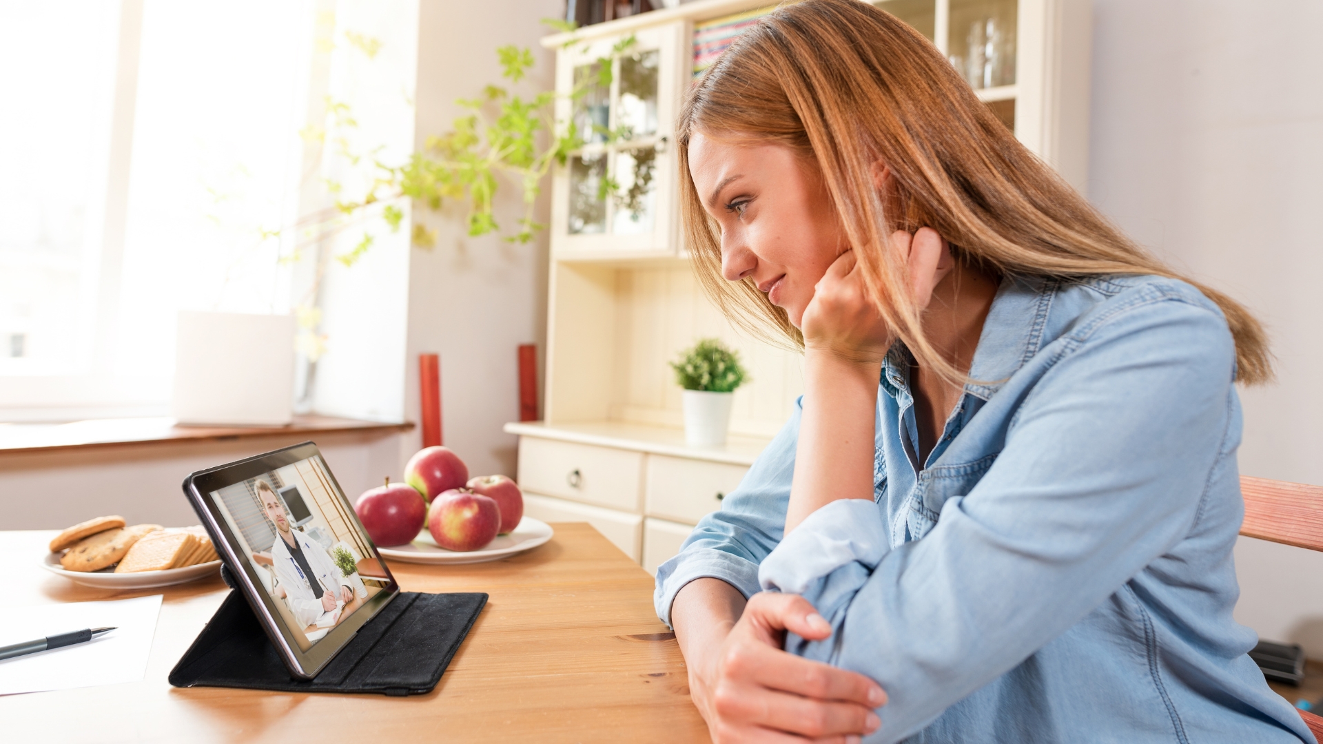 Child connecting with a pediatric therapist through telehealth