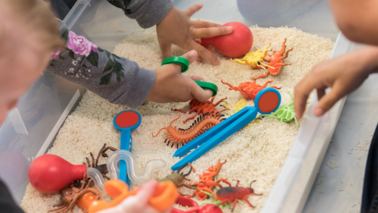 A young child and a parent moving through an everyday home routine together in warm daylight.